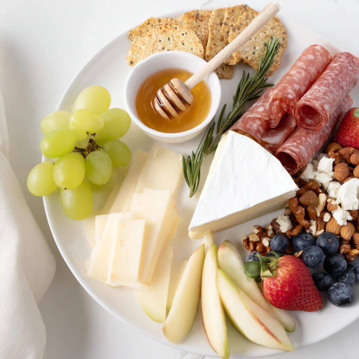 Enjoy this Quick Charcuterie snack board bursting with savory cured meats alongside sweet fruits.