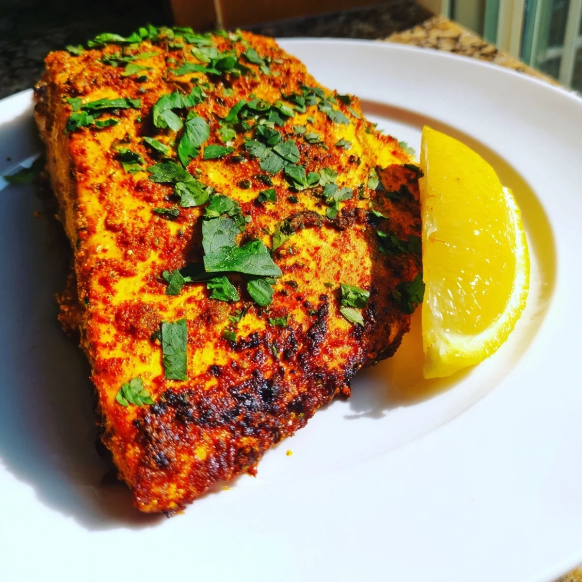 Vibrant, roasted Indian Tikka Salmon, beautifully cooked with a rich spiced yogurt marinade.