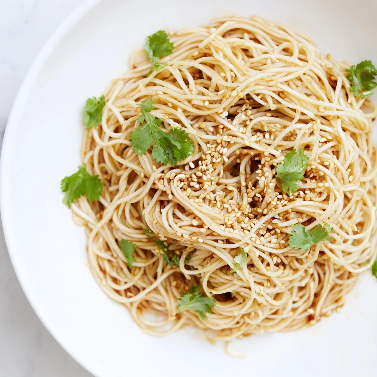 Tossing Spicy Sesame Noodle Salad with a bold chili, soy, and sesame oil dressing, plus chopped peanuts for texture.