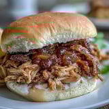 Shredded Applesauce Pulled Pork Sandwiches stuffed with tender meat and creamy coleslaw for dinner.