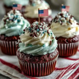 Close-up of Star-Spangled Banner Cupcakes, showcasing vibrant red, white, and blue frosted swirls.
