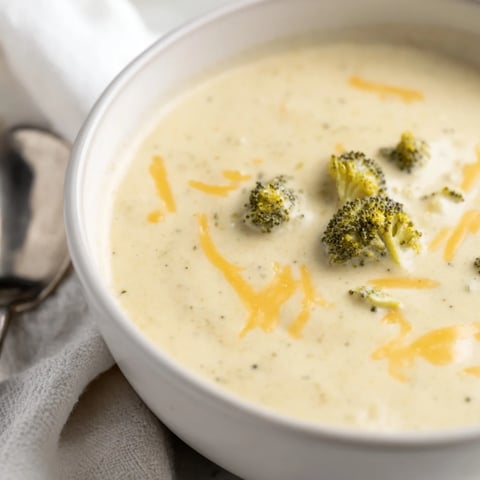 Golden roasted broccoli florets and melted sharp cheddar cheese swirl in a creamy, velvety bowl of this homemade broccoli cheddar soup.