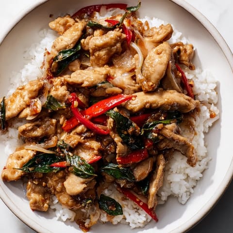 A close-up of savory Thai Basil Chicken Bowls: a flavorful, colorful, and fresh Asian dinner.