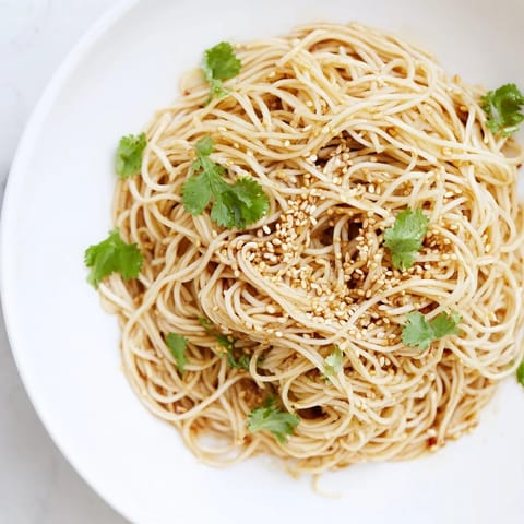 Tossing Spicy Sesame Noodle Salad with a bold chili, soy, and sesame oil dressing, plus chopped peanuts for texture.