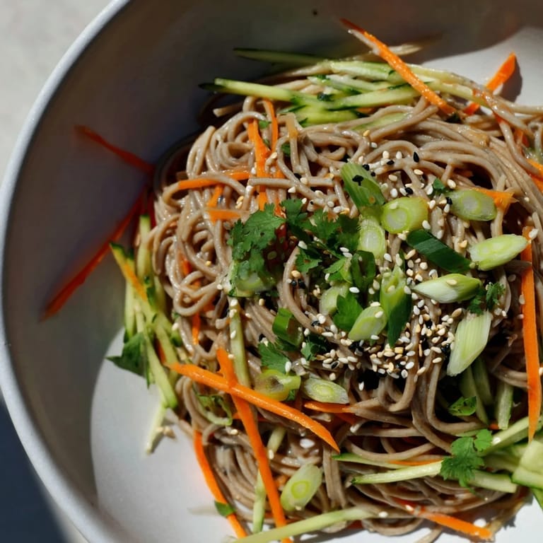 Imagine a close-up of delicious Chilled Noodle Lunch Cups, with vibrant vegetables and noodles tossed in savory sauce.