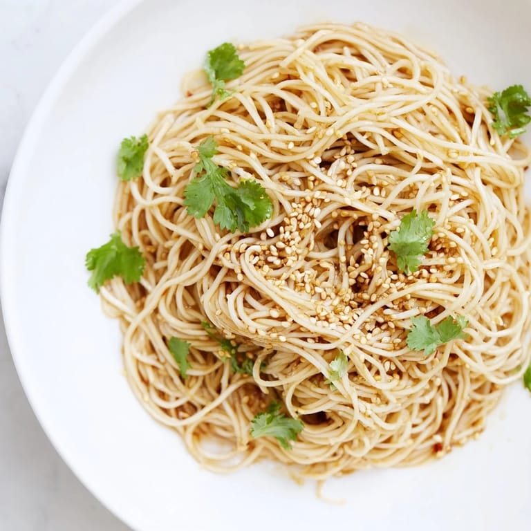 Tossing Spicy Sesame Noodle Salad with a bold chili, soy, and sesame oil dressing, plus chopped peanuts for texture.